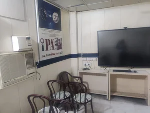 Teaching corner with smart board and IPA software poster (Tally, BUSY, SAP)