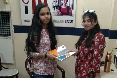 A student receiving her course certificate at IPA, Laxmi Nagar