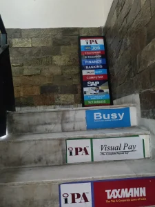 Staircase landing at IPA with the course board and software step signs