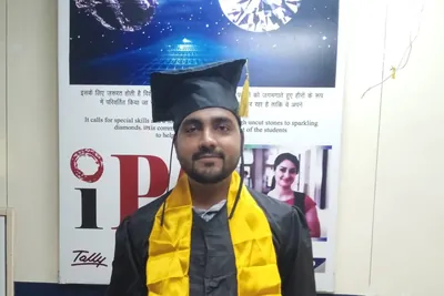 An IPA diploma student in graduation gown and stole at the Laxmi Nagar institute