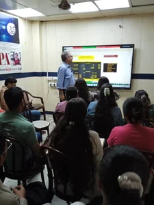 Faculty member taking an accounts class on the smart board at IPA, E-54 Laxmi Nagar